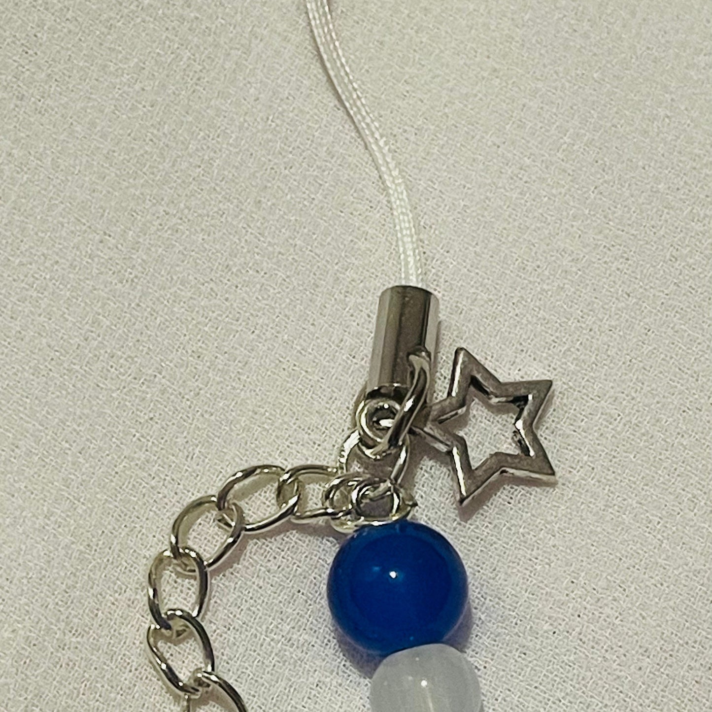 Sanrio phone charm ( cinnamoroll ) with beads and (star) charms attached