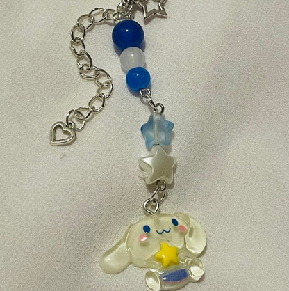 Sanrio phone charm ( cinnamoroll ) with beads and (star) charms attached  